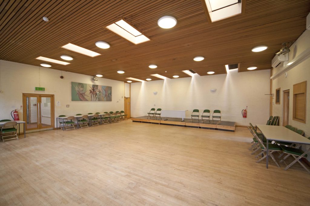 Churchill Room in Wanstead library, empty hall with chairs along the sides
