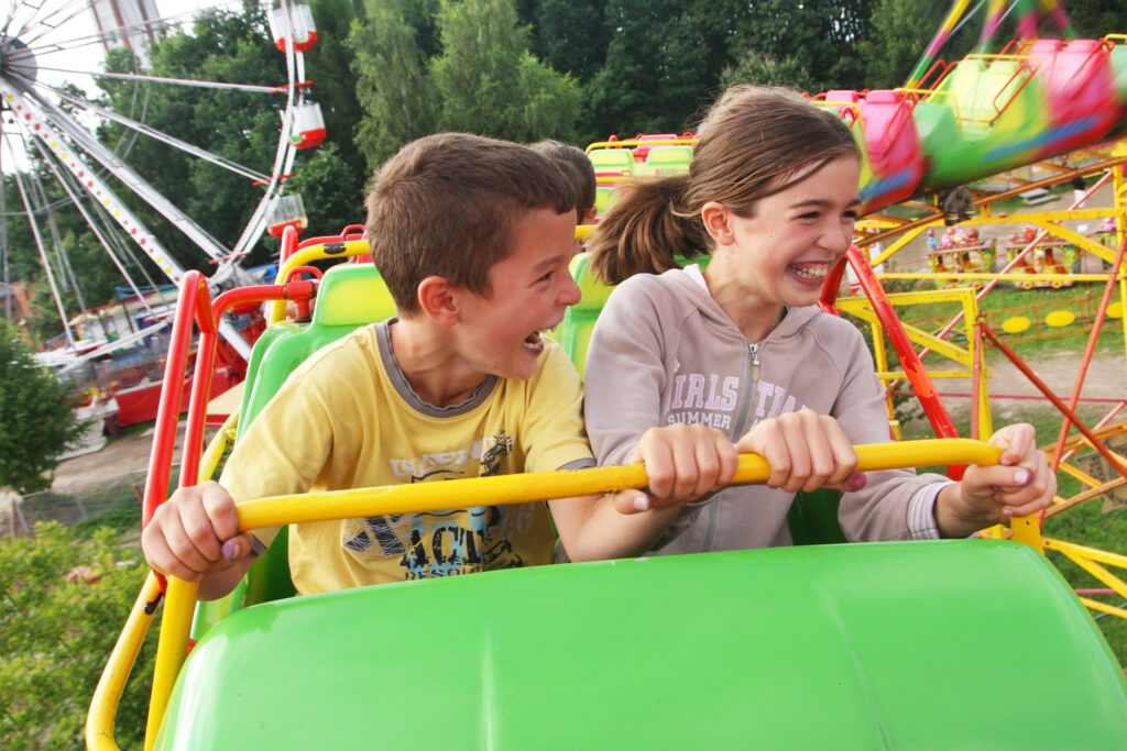 children on funfair ride