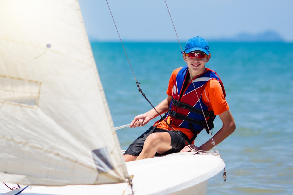 young boy sailing