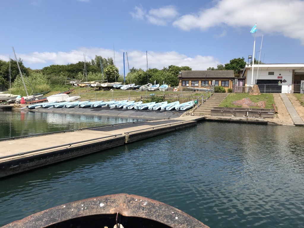 view of Fairlop outdoor activity centre with boats lined up outside on the dock